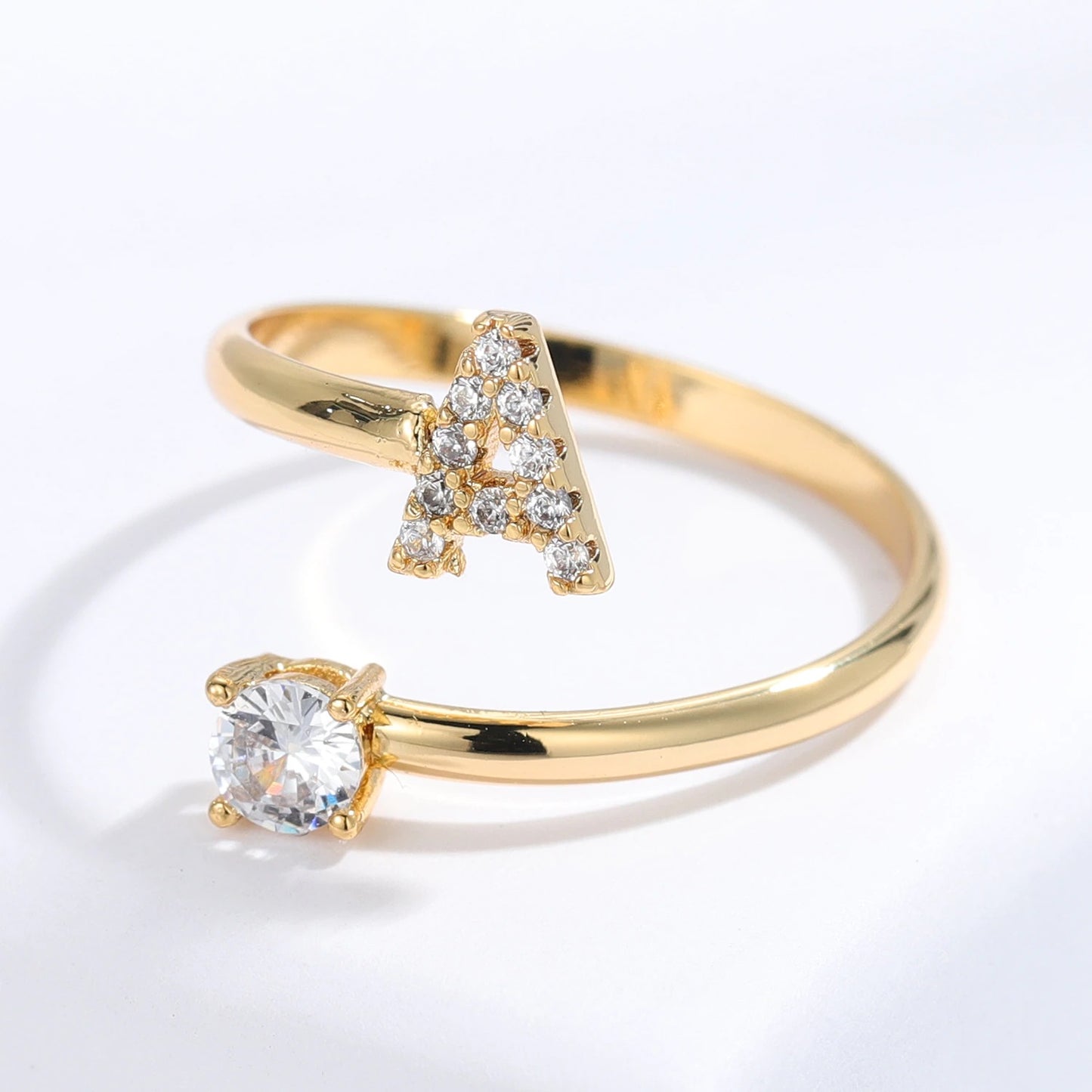 Diamond letter ring by MUHVA STORE featuring a sparkling letter design with embedded diamonds in a sleek band.