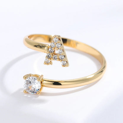 Diamond letter ring by MUHVA STORE featuring a sparkling letter design with embedded diamonds in a sleek band.