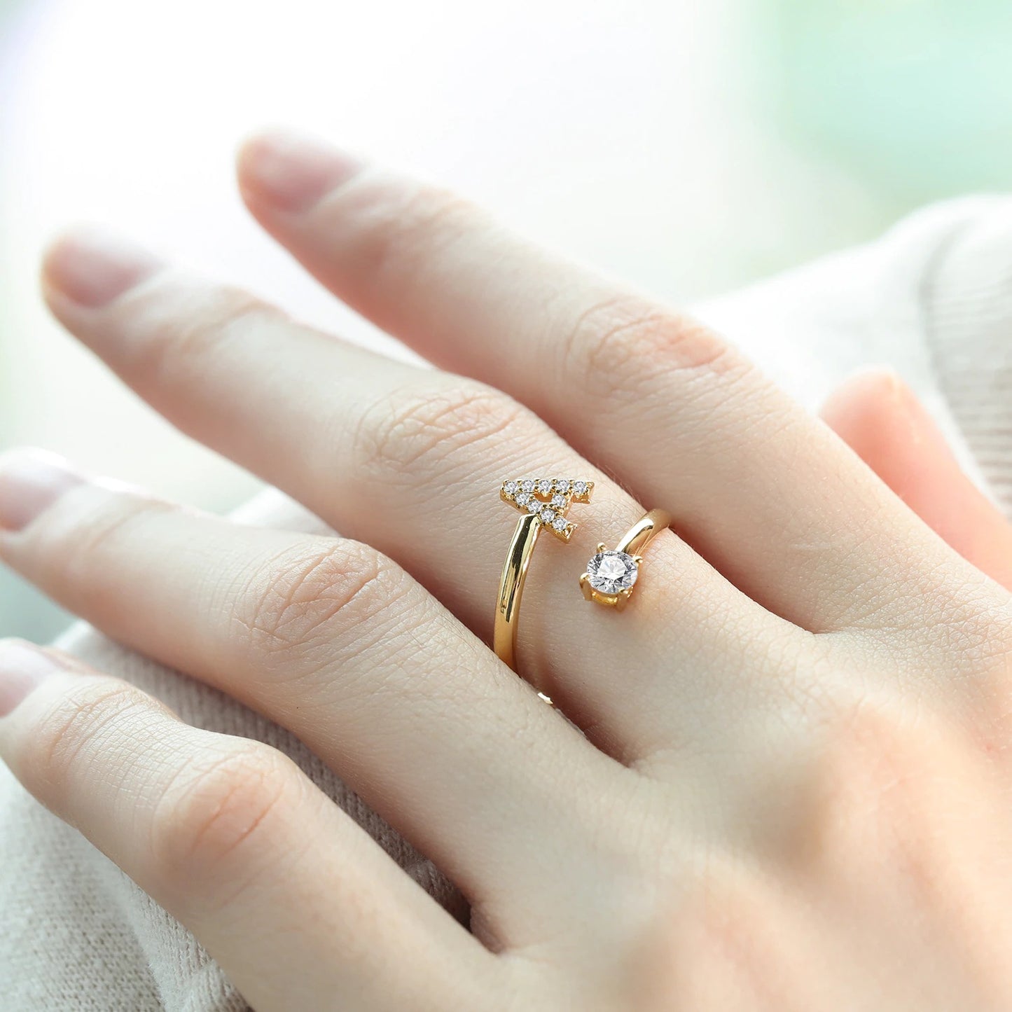 Shiny gold diamond letter ring from MUHVA STORE showcasing a personalized initial with sparkling diamonds on a sleek band.