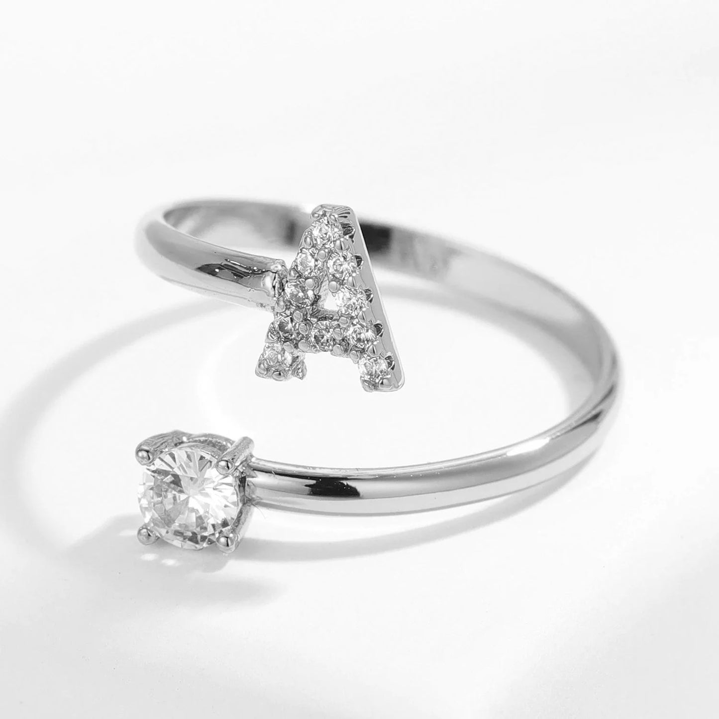 Gold diamond letter ring from MUHVA STORE featuring a sparkling letter design and elegant band detail.