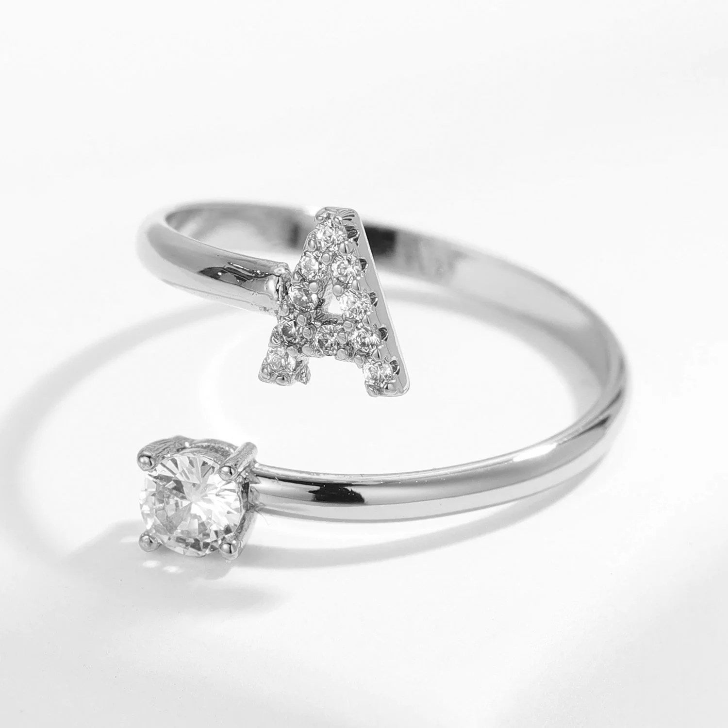 Gold diamond letter ring from MUHVA STORE featuring a sparkling letter design and elegant band detail.