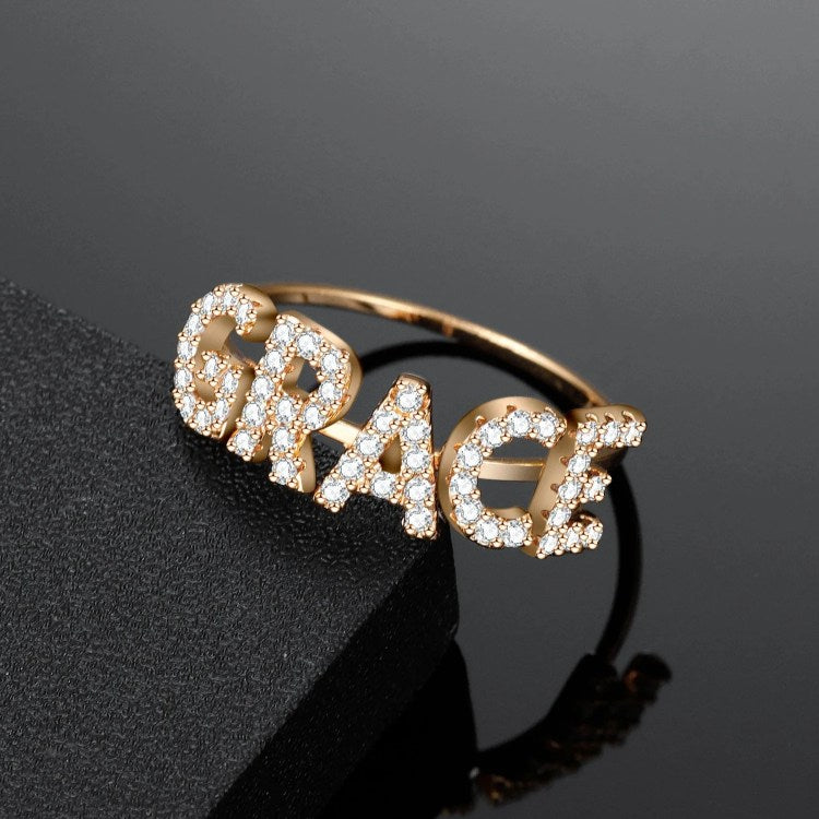 Elegant diamond name ring from MUHVA STORE featuring sparkling diamonds and personalized engraving in sterling silver.