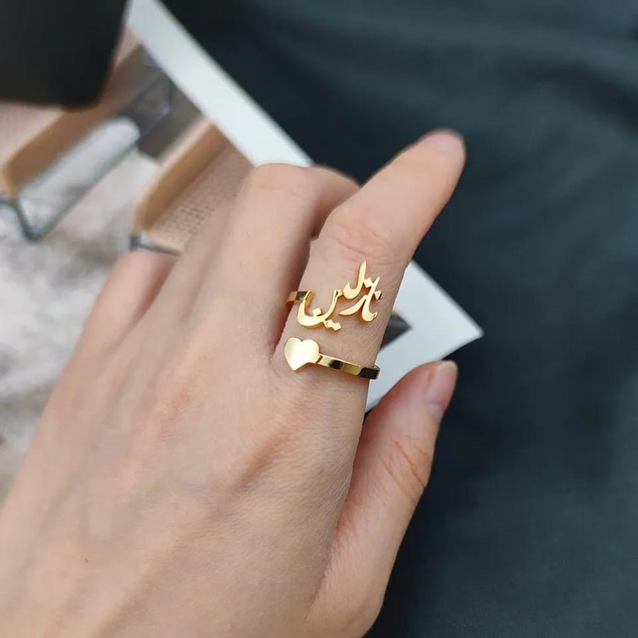 Arabic heart name ring from MUHVA STORE featuring a personalized engraved heart-shaped design on a sleek silver band.