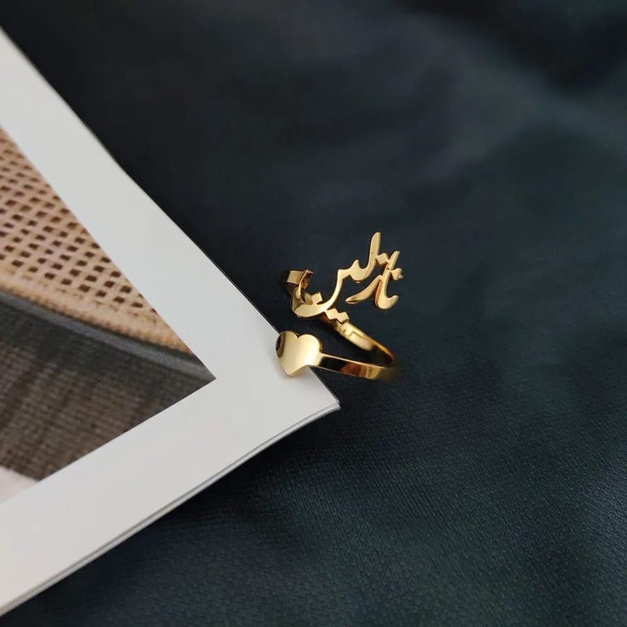 Elegant Arabic Heart Name Ring by MUHVA STORE featuring personalized heart-shaped design and intricate Arabic script.
