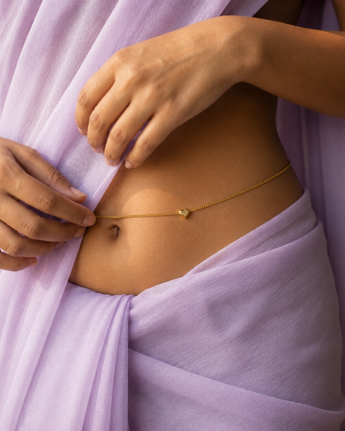 Gold spark waist chain by MUHVA STORE featuring a delicate chain with sparkling gold accents for stylish waist jewelry.