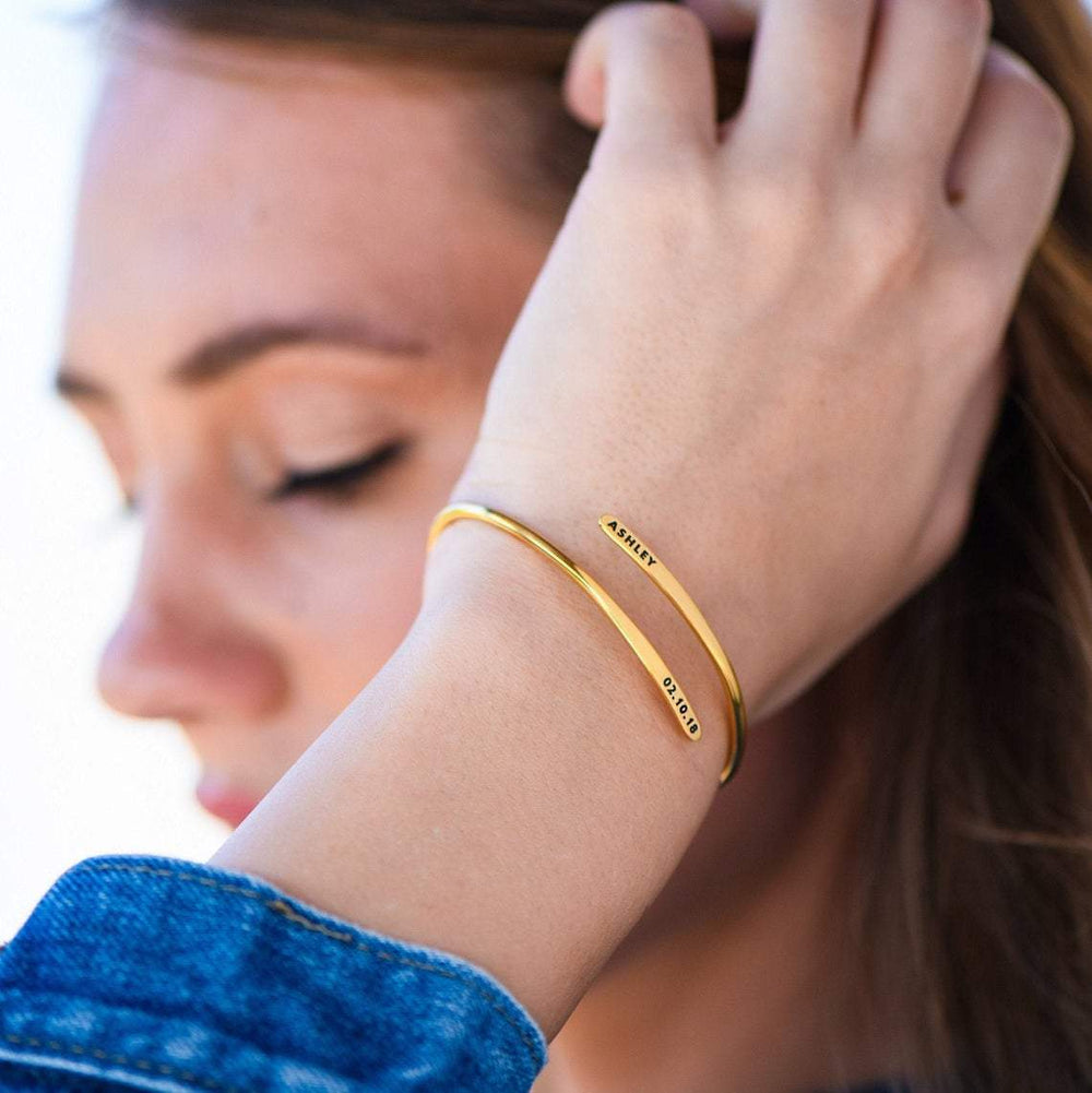Personalized name bangle bracelet from MUHVA STORE with custom engraved name, sleek silver design, and smooth finish.