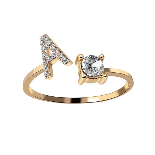 Pair of initial letter rings from MUHVA STORE featuring engraved alphabet characters in a sleek, minimalist design.