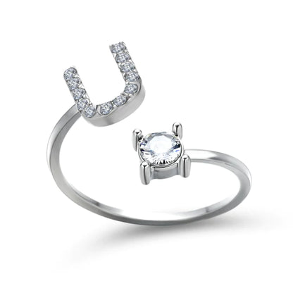 Pair of initial letter rings from MUHVA STORE, featuring simple silver bands with engraved letter R design.