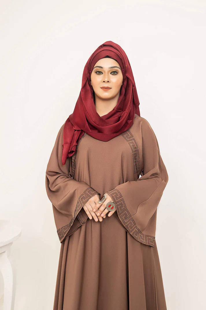 SAYADA by MUHVA STORE, stylish modern hijab in soft fabric, displayed on a hanger with neutral background.