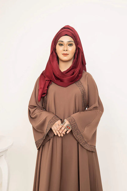 SAYADA by MUHVA STORE, stylish modern hijab in soft fabric, displayed on a hanger with neutral background.