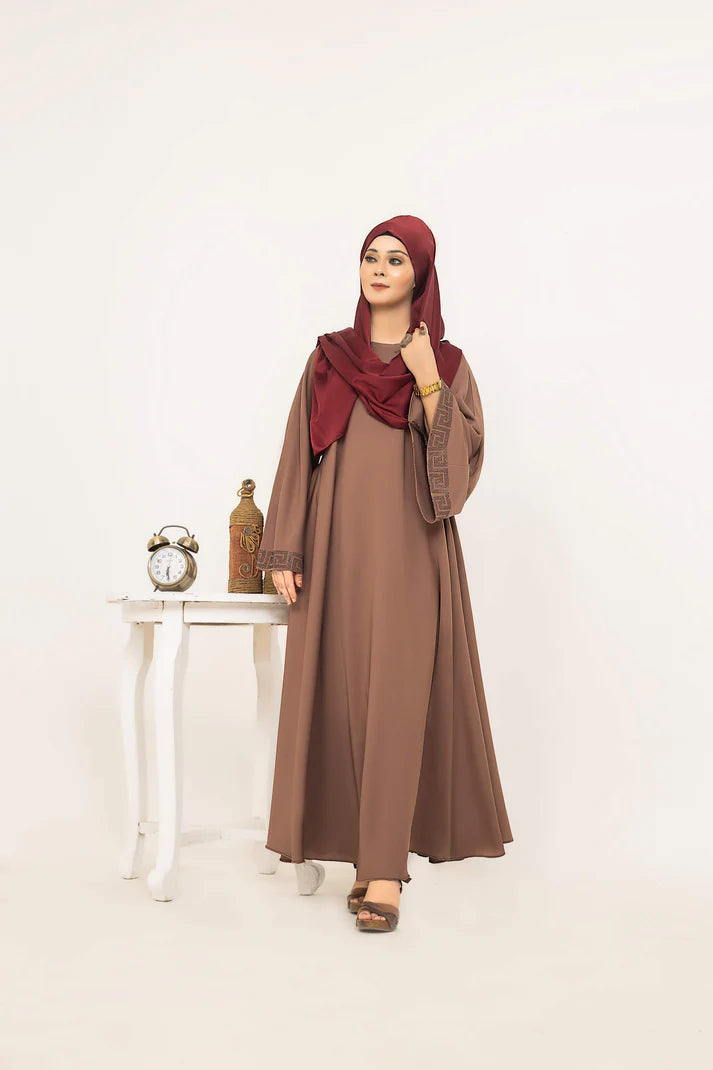 SAYADA by MUHVA STORE, stylish women's dress with intricate embroidery, displayed on a hanger against a white background.