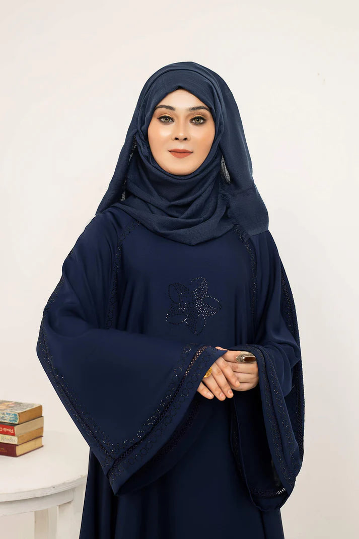 Hadeel brand perfume bottle by Muhva Store with elegant glass design and floral label, displayed on a neutral background