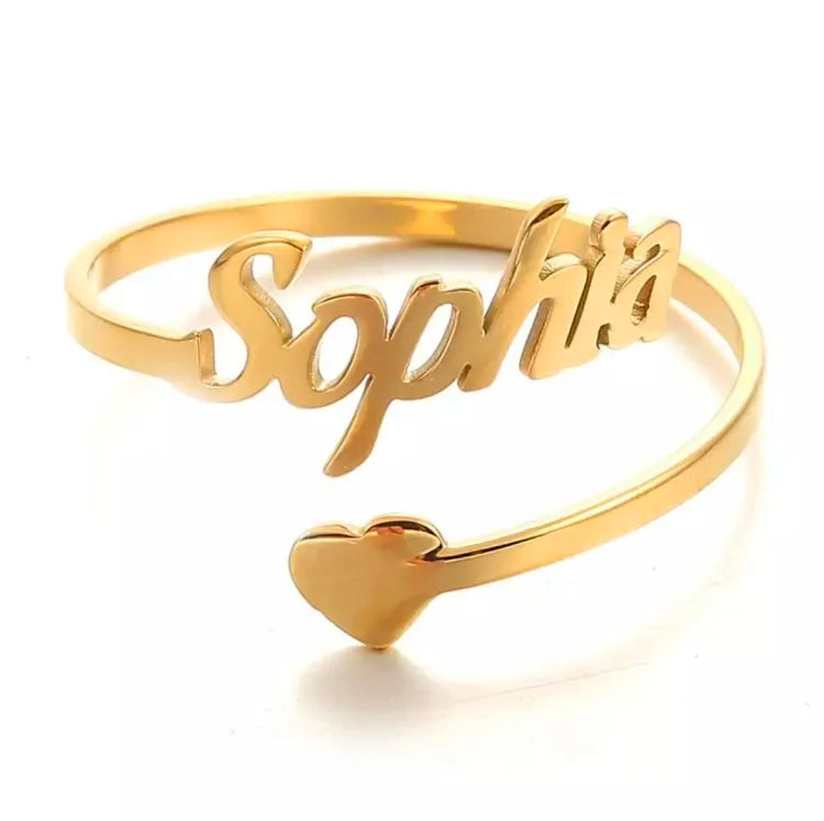 Pair of adjustable custom name rings from Muhva Store, featuring personalized engraved designs on silver-colored bands.