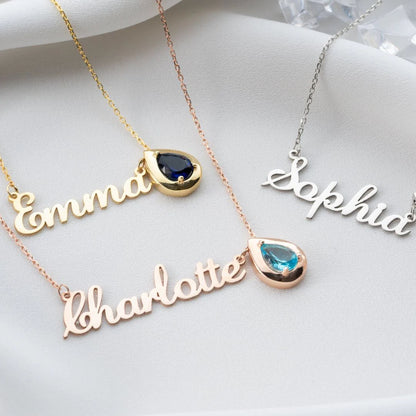 Gold necklace with a personalized birthstone and name pendant from MUHVA STORE, showcasing a custom engraved jewelry piece.