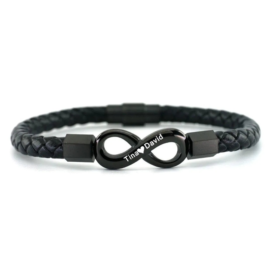 Personalized leather bracelet for husband with two names and infinity symbol, featuring sleek black leather and engraved silver accents.