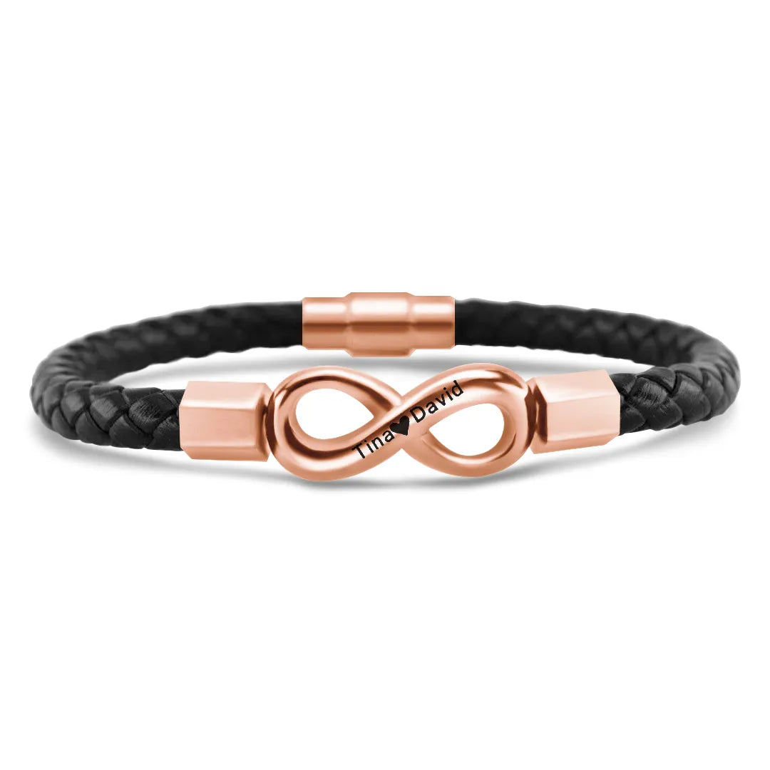 Personalized leather infinity bracelet for husband with two engraved names, featuring a sleek leather band and silver accents.