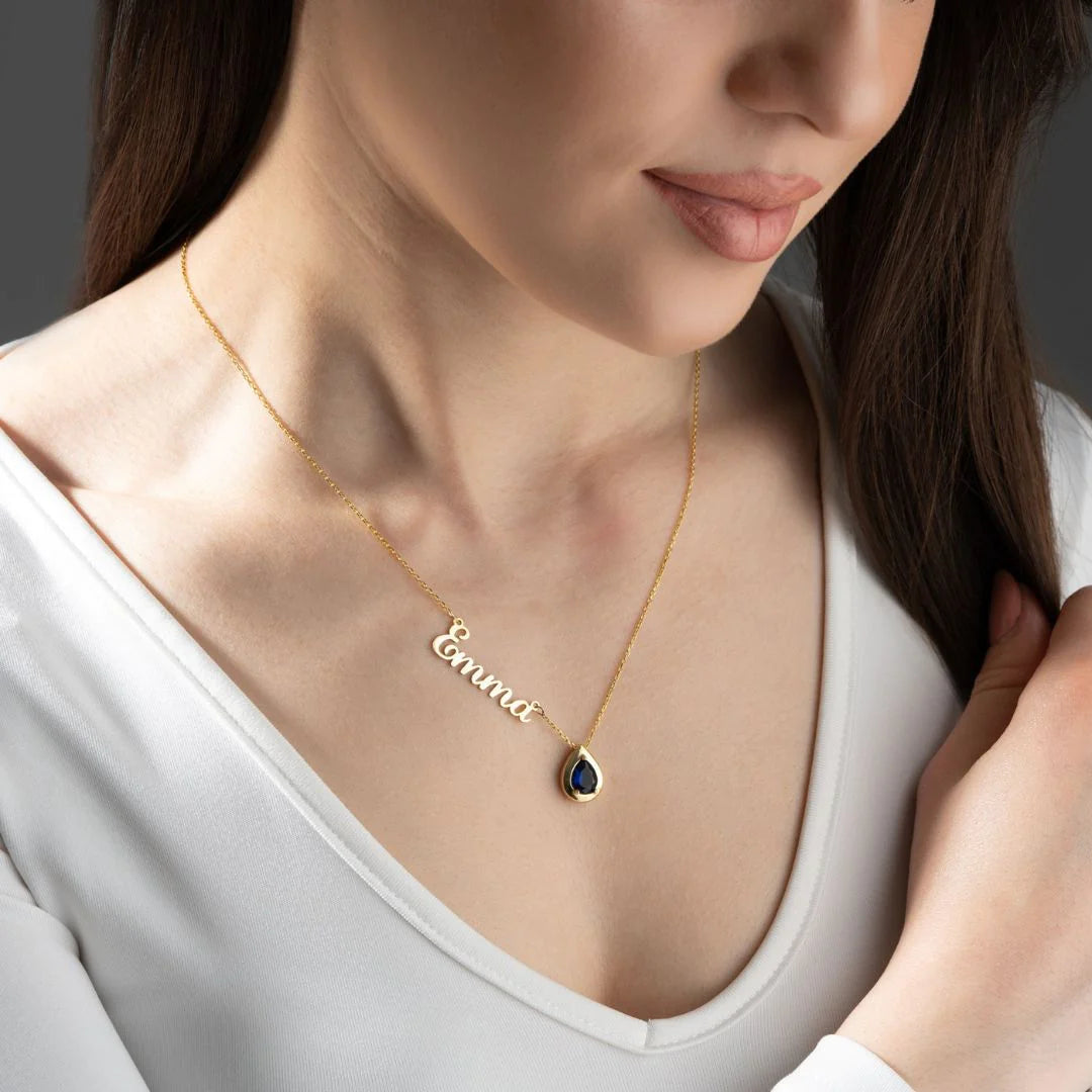 Gold Sophia birthstone name necklace featuring personalized engraved name and a colorful birthstone charm from MUHVA STORE.