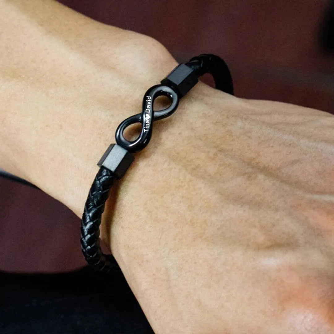 Personalized leather bracelet for husband with engraved two names and infinity design, featuring black leather band and silver accents.