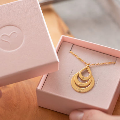Customized drop necklace with three name pendants from MUHVA STORE, featuring elegant silver chain and personalized letter charms.