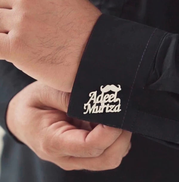 Pair of stylish MUHVA STORE cufflinks in a pack of two, featuring sleek metallic designs for formal wear.