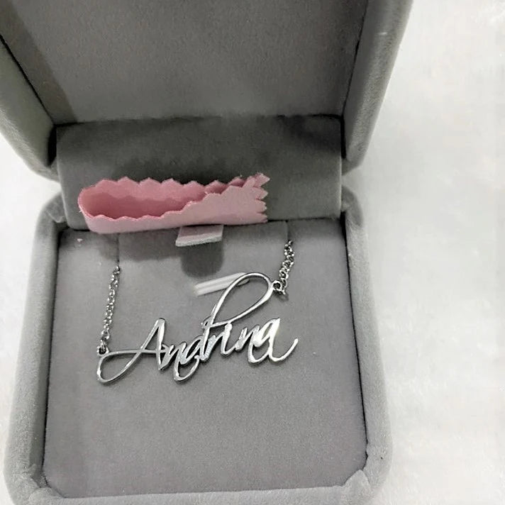 Custom script name necklace with cursive hand-lettered pendant, featuring personalized name design from MUHVA STORE.