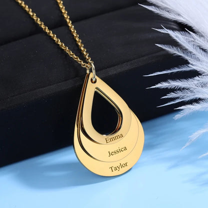 Customized drop necklace with three name pendants from MUHVA STORE, featuring elegant silver chain and personalized engraved names.