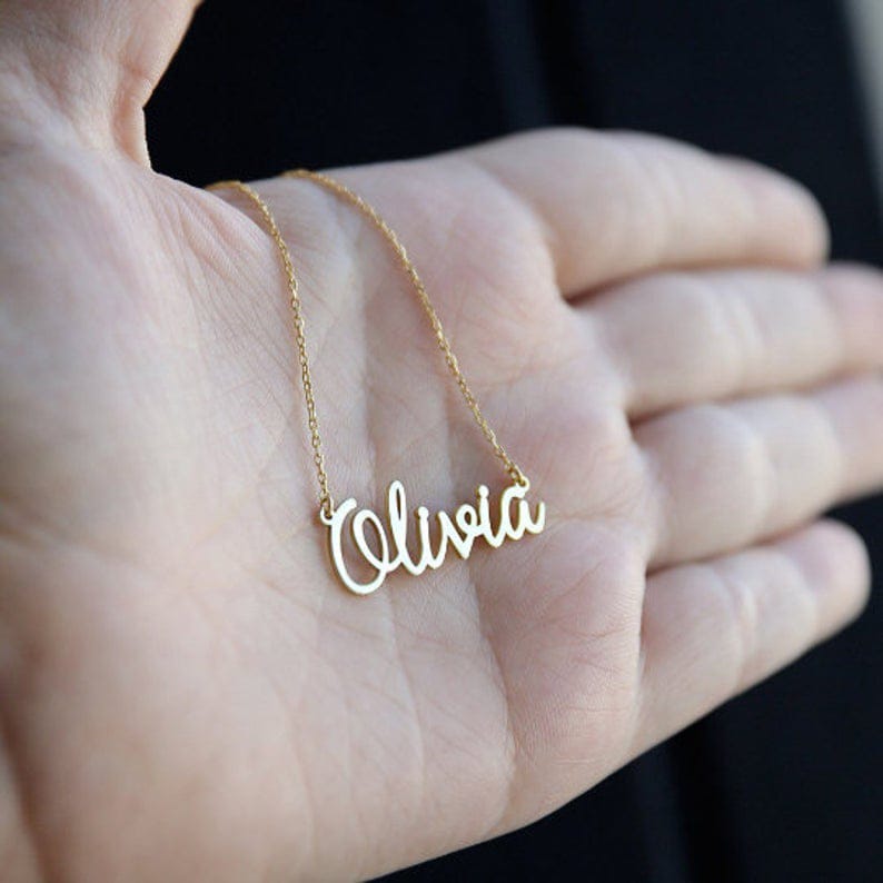 Personalized name necklace from Muhva Store featuring a custom engraved pendant on a delicate chain.