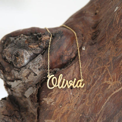 Personalized name necklace from Muhva Store featuring a sleek chain and custom engraved name in elegant script.