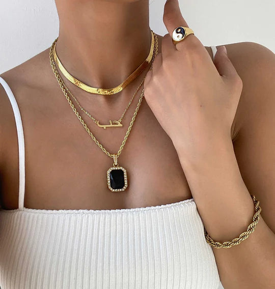 Arabic name custom necklace from MUHVA STORE featuring a delicate chain and personalized Arabic script pendant.