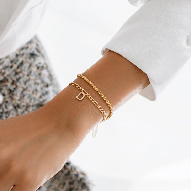 Elegant letter necklace and bracelet set by MUHVA STORE featuring gold-toned jewelry with custom letter charms.