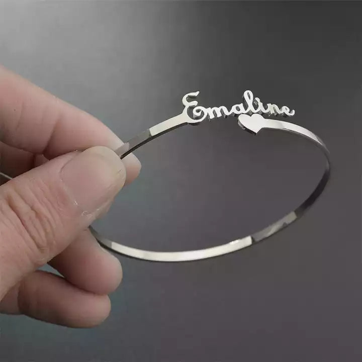Personalized name bracelet with a heart charm from Muhva Store, featuring custom engraving and delicate jewelry design.