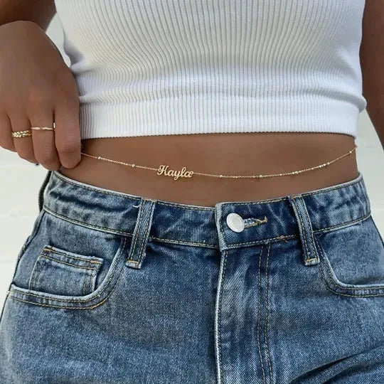 Custom name belly chain by Muhva Store featuring a delicate silver design with a personalized name pendant.