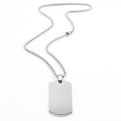 Two silver customized pendants with engraved designs from Muhva Store, showcasing detailed craftsmanship and sleek silver finish.