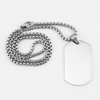 Two silver classic customized pendants with personalized designs, displayed on a neutral background.