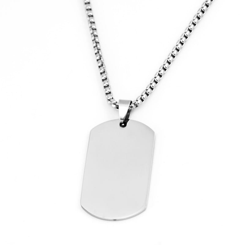 Two silver customized pendants with engraved designs, showcasing classic style and detailed craftsmanship.