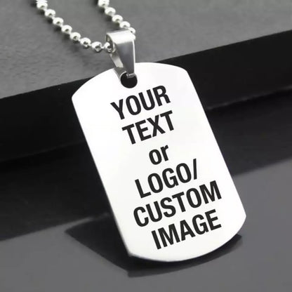 Two silver personalized pendants with engraved designs, showcasing a classic style, perfect for custom jewelry accessories.