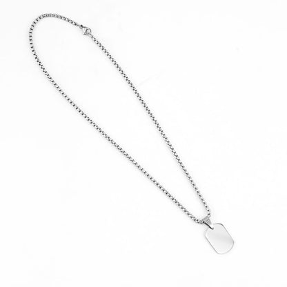 Two silver customized pendants with engraved designs, featuring classic style and polished finish, ideal for personalized jewelry.