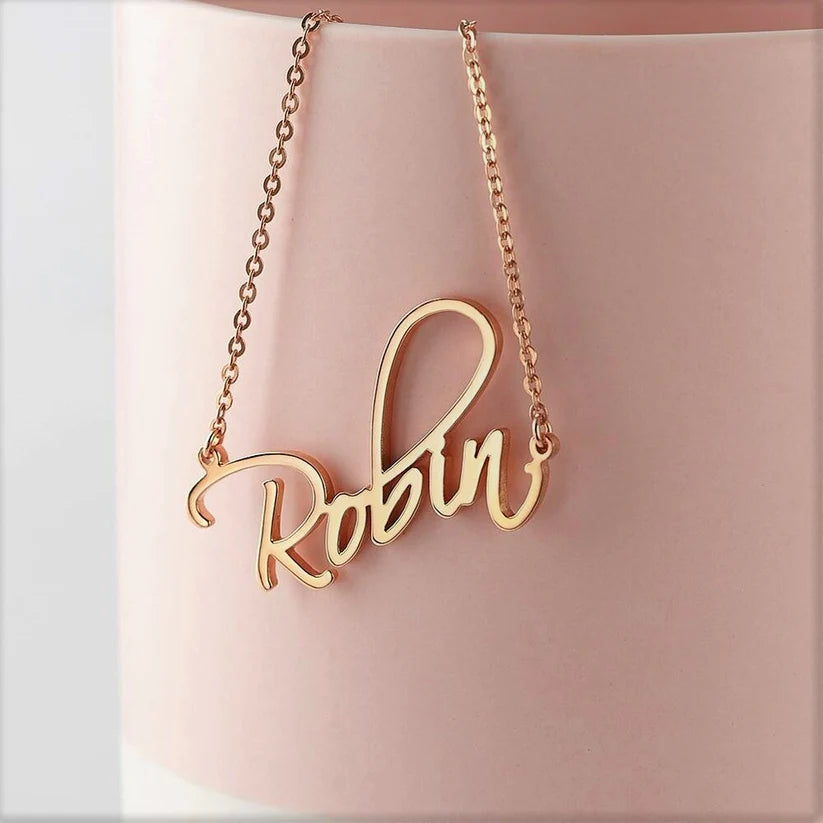 Rose gold Script Name Necklace by MUHVA STORE featuring personalized cursive lettering on elegant jewelry.