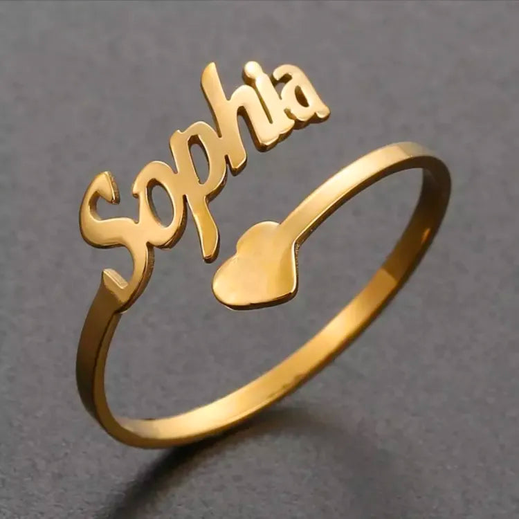 Pair of adjustable Muhva Store custom name rings in silver with engraved personalized text, displayed on a plain background.