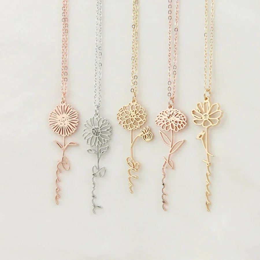 Personalized name necklace with birth flower charm, elegant jewelry piece from MUHVA STORE featuring custom engraving and floral detail.