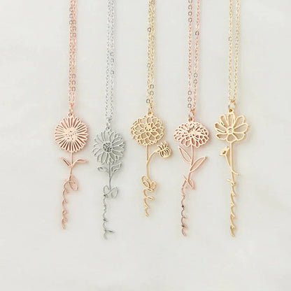 Personalized name necklace with birth flower charm, elegant jewelry piece from MUHVA STORE featuring custom engraving and floral detail.