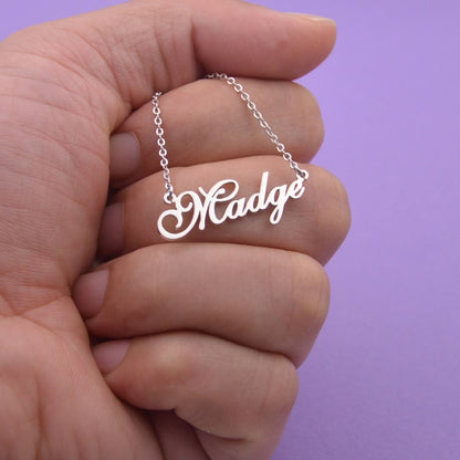 Personalized name necklace from Muhva Store featuring a sleek chain and custom engraved name pendant.