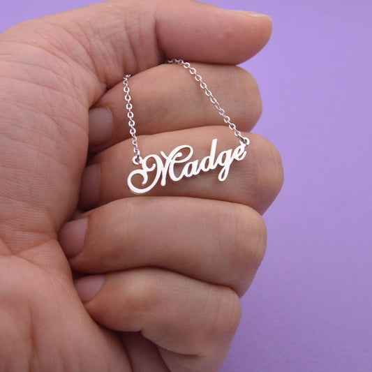 Personalized name necklace from Muhva Store featuring a sleek chain and custom engraved name pendant.