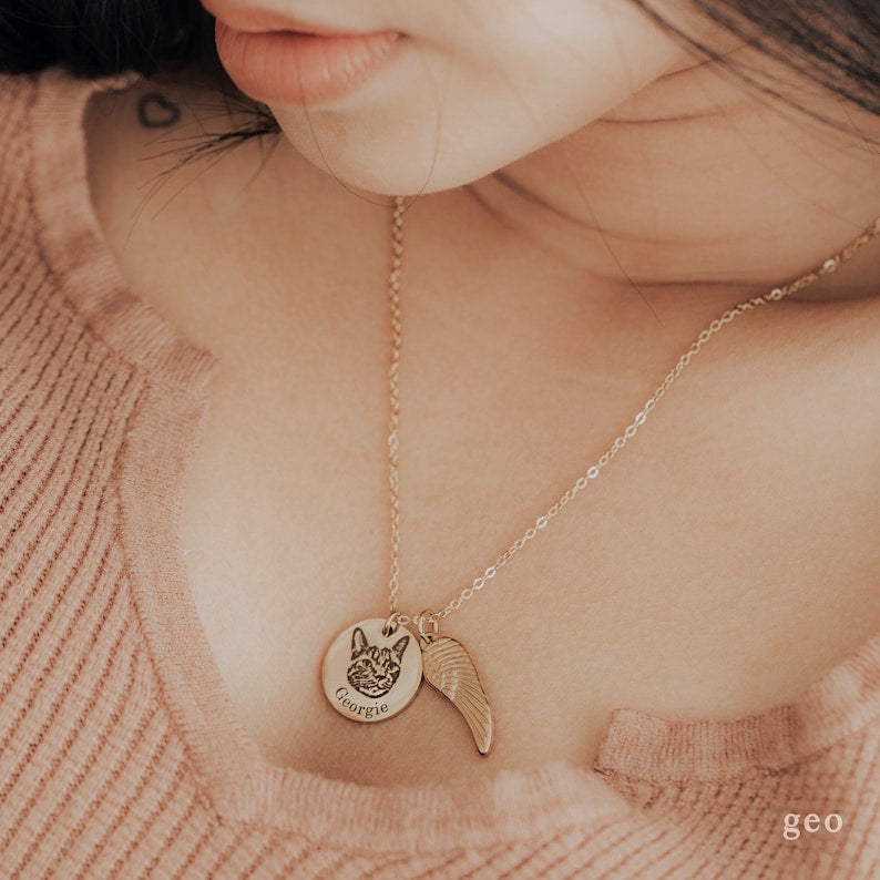 Two custom pet portrait necklaces with engraved pet images on silver pendants from Muhva Store.