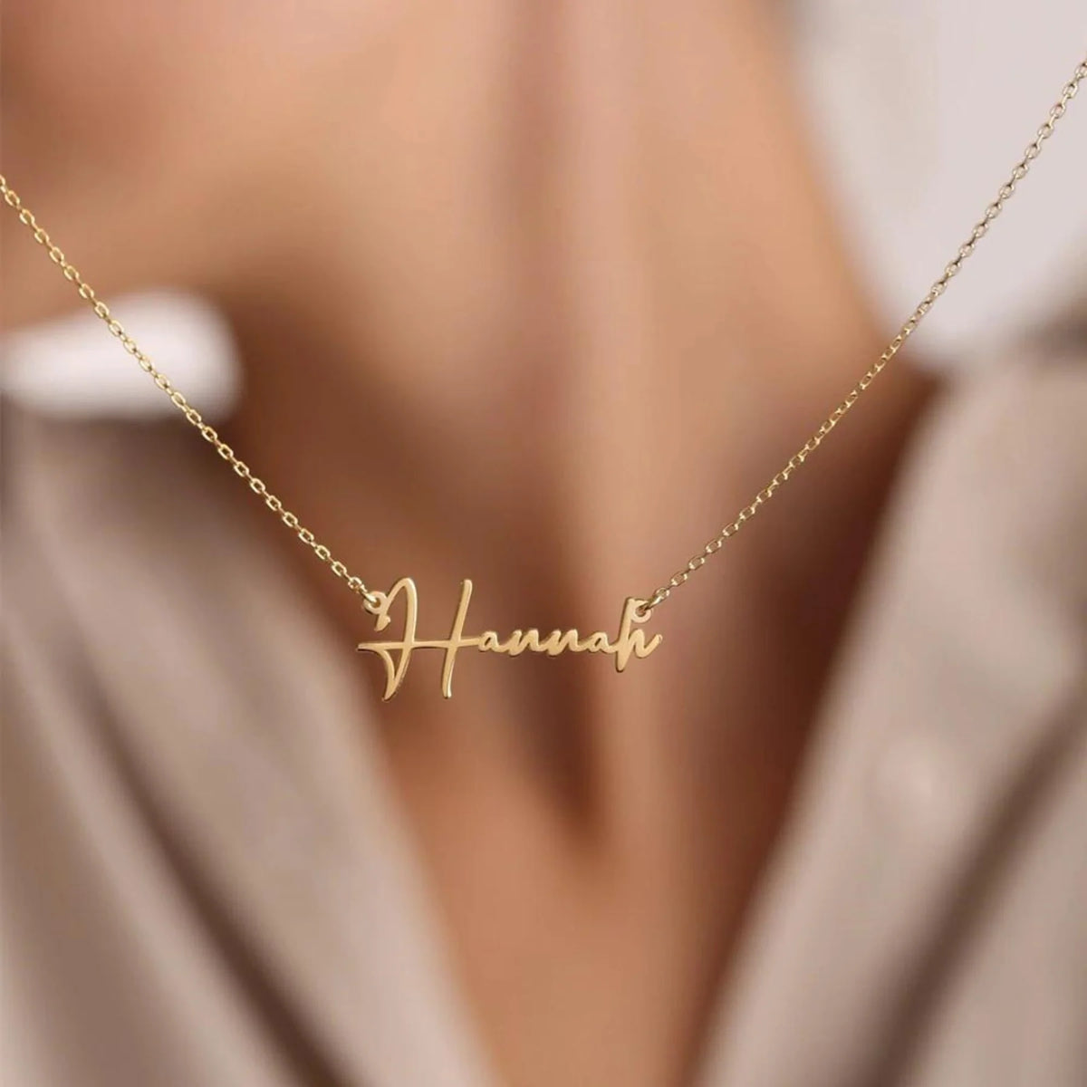 Gold plated signature name necklace by MUHVA STORE, showcasing a personalized name pendant on a delicate chain.