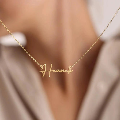 Gold plated signature name necklace by MUHVA STORE, showcasing a personalized name pendant on a delicate chain.
