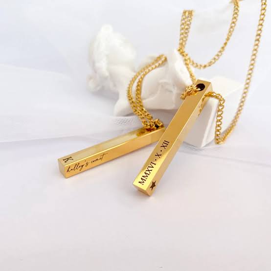 Two customizable name necklaces from Muhva Store featuring elegant pendant designs on delicate chains.