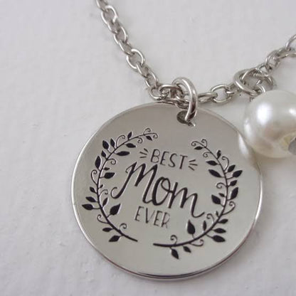 Pair of Muhva Store "Best Mom Ever" necklaces with heart and pendant designs, perfect for Mother's Day or special gifts.