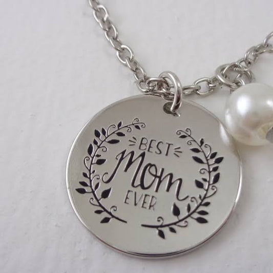 Pair of Muhva Store "Best Mom Ever" necklaces with heart and pendant designs, perfect for Mother's Day or special gifts.