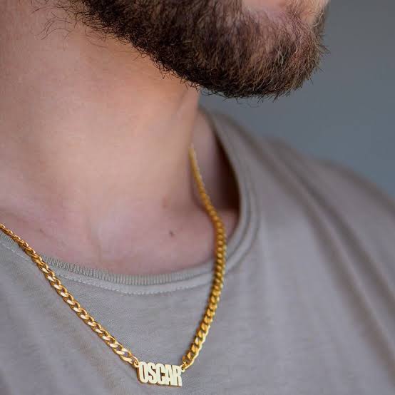 Personalized name necklace from Muhva Store featuring a sleek chain and custom engraved name pendant on a neutral background.